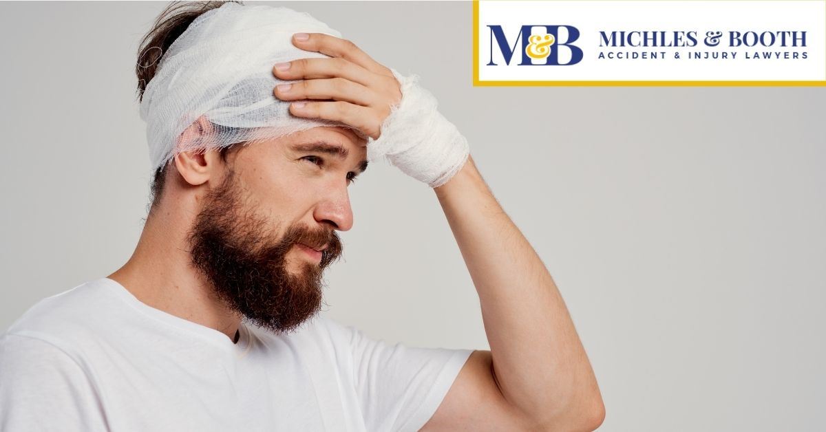 Man with bandages on his head